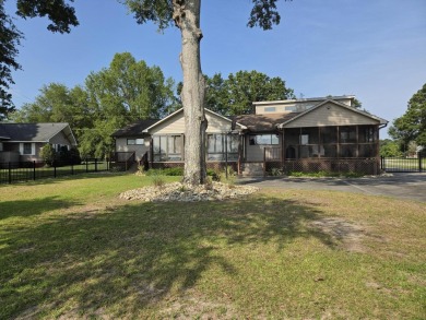 Deepwater lakefront home at Taw Caw Creek on Lake Marione view on Foxboro Golf Club in South Carolina - for sale on GolfHomes.com, golf home, golf lot