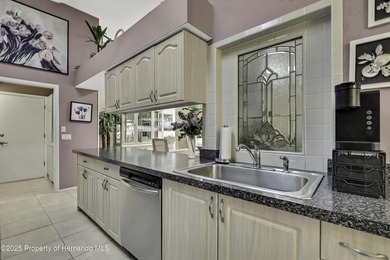 Welcome to this bright and spacious Oakmont villa located in the on Timber Pines Golf Course in Florida - for sale on GolfHomes.com, golf home, golf lot