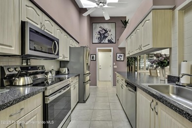 Welcome to this bright and spacious Oakmont villa located in the on Timber Pines Golf Course in Florida - for sale on GolfHomes.com, golf home, golf lot