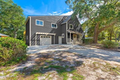 This spacious beach house offers extensive modern updates with on Oak Island Golf Club in North Carolina - for sale on GolfHomes.com, golf home, golf lot