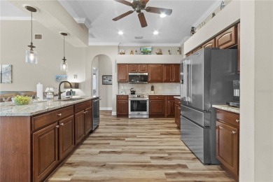 Step into timeless Florida living in this spacious and move in on Heritage Isles Golf and Country Club in Florida - for sale on GolfHomes.com, golf home, golf lot