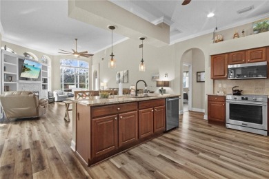 Step into timeless Florida living in this spacious and move in on Heritage Isles Golf and Country Club in Florida - for sale on GolfHomes.com, golf home, golf lot