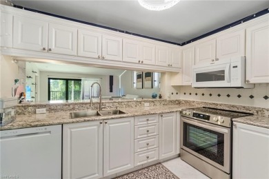 UPDATED KITCHEN WITH QUARTZ COUNTERS, IMPACT WINDOWS AND SLIDERS on Royal Wood Golf and Country Club in Florida - for sale on GolfHomes.com, golf home, golf lot