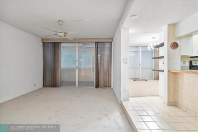 This spacious 3-bedroom, 2.5-bathroom corner unit townhome is on Pine Island Ridge Country Club in Florida - for sale on GolfHomes.com, golf home, golf lot