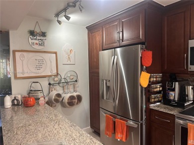 This beautifully remodeled 2 bedroom 2 bath condo is located in on Sunrise Lakes Phase IV Golf Course in Florida - for sale on GolfHomes.com, golf home, golf lot