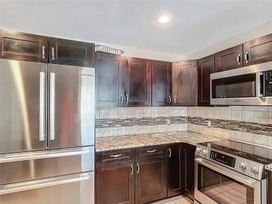 Amazing Pool home on 1 acre with complete outside kitchen by on Indian Lake Estates Golf and Country Club in Florida - for sale on GolfHomes.com, golf home, golf lot