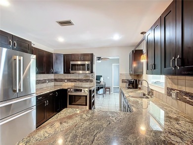Amazing Pool home on 1 acre with complete outside kitchen by on Indian Lake Estates Golf and Country Club in Florida - for sale on GolfHomes.com, golf home, golf lot