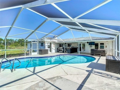 Amazing Pool home on 1 acre with complete outside kitchen by on Indian Lake Estates Golf and Country Club in Florida - for sale on GolfHomes.com, golf home, golf lot
