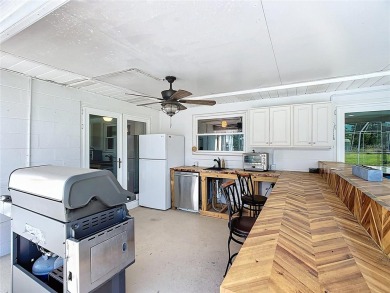 Amazing Pool home on 1 acre with complete outside kitchen by on Indian Lake Estates Golf and Country Club in Florida - for sale on GolfHomes.com, golf home, golf lot