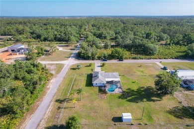 Amazing Pool home on 1 acre with complete outside kitchen by on Indian Lake Estates Golf and Country Club in Florida - for sale on GolfHomes.com, golf home, golf lot