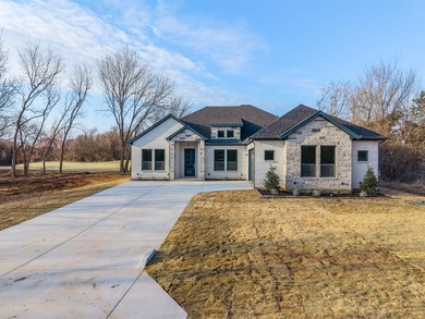 Exquisite home has four bedrooms, two and half bathrooms.  1,953 on White Bluff Resort - New Course in Texas - for sale on GolfHomes.com, golf home, golf lot