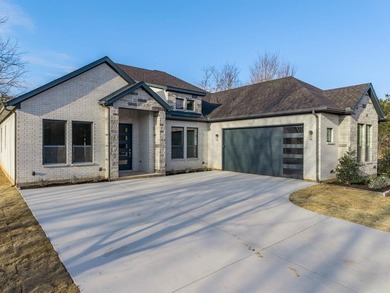 Exquisite home has four bedrooms, two and half bathrooms.  1,953 on White Bluff Resort - New Course in Texas - for sale on GolfHomes.com, golf home, golf lot