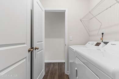 The Givens offers a beautifully crafted two-story design that on Harbour Point Golf Club in North Carolina - for sale on GolfHomes.com, golf home, golf lot