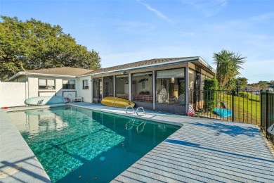 This charming waterfront canal home is a boater's delight with on Palm Harbor Golf Club in Florida - for sale on GolfHomes.com, golf home, golf lot