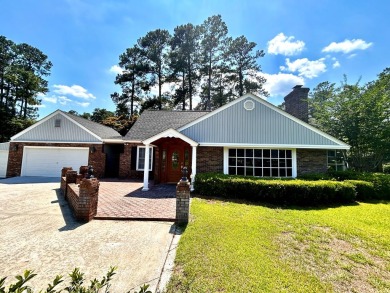 Beautiful home on the golf course in a gated community! Home has on Santee-Cooper Country Club in South Carolina - for sale on GolfHomes.com, golf home, golf lot