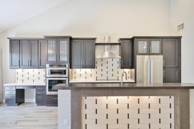 Single-level remodeled jewel box on a prime corner overlooking on Gainey Ranch Golf Club in Arizona - for sale on GolfHomes.com, golf home, golf lot