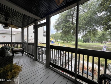 Updated End Unit Townhome with additional heated/cooled sq on Diamondhead Country Club in Mississippi - for sale on GolfHomes.com, golf home, golf lot