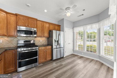 Stunning Show home in The Village at Deaton Creek with premium on Reunion Golf Club in Georgia - for sale on GolfHomes.com, golf home, golf lot