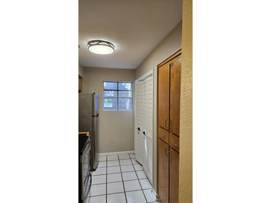 Renovated contemporary townhome with fun diagonal design on Hilaman Park Golf Course in Florida - for sale on GolfHomes.com, golf home, golf lot