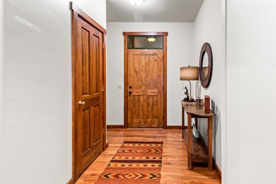 Set along the 2nd green in the prestigious Eagle Bend Golf on Eagle Bend Golf Course in Montana - for sale on GolfHomes.com, golf home, golf lot