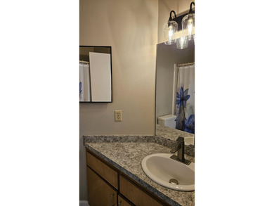 Renovated contemporary townhome with fun diagonal design on Hilaman Park Golf Course in Florida - for sale on GolfHomes.com, golf home, golf lot