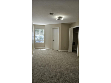 Renovated contemporary townhome with fun diagonal design on Hilaman Park Golf Course in Florida - for sale on GolfHomes.com, golf home, golf lot