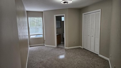 Renovated contemporary townhome with fun diagonal design on Hilaman Park Golf Course in Florida - for sale on GolfHomes.com, golf home, golf lot