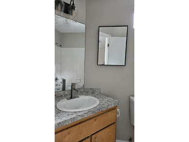 Renovated contemporary townhome with fun diagonal design on Hilaman Park Golf Course in Florida - for sale on GolfHomes.com, golf home, golf lot