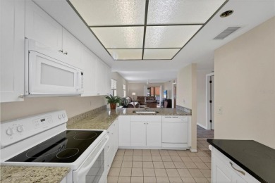 Step inside this beautiful END UNIT to be greeted by neutral on Capri Isle Golf Club in Florida - for sale on GolfHomes.com, golf home, golf lot