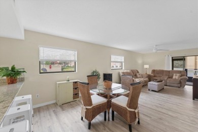 Step inside this beautiful END UNIT to be greeted by neutral on Capri Isle Golf Club in Florida - for sale on GolfHomes.com, golf home, golf lot