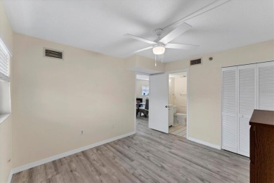 Step inside this beautiful END UNIT to be greeted by neutral on Capri Isle Golf Club in Florida - for sale on GolfHomes.com, golf home, golf lot
