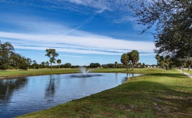 Step inside this beautiful END UNIT to be greeted by neutral on Capri Isle Golf Club in Florida - for sale on GolfHomes.com, golf home, golf lot