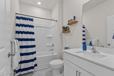 Nestled on a quiet cul-de-sac, this single-level four-bedroom on Harbour Point Golf Club in North Carolina - for sale on GolfHomes.com, golf home, golf lot