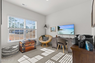 Nestled on a quiet cul-de-sac, this single-level four-bedroom on Harbour Point Golf Club in North Carolina - for sale on GolfHomes.com, golf home, golf lot