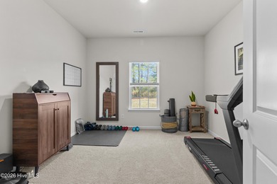 Nestled on a quiet cul-de-sac, this single-level four-bedroom on Harbour Point Golf Club in North Carolina - for sale on GolfHomes.com, golf home, golf lot