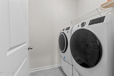 Nestled on a quiet cul-de-sac, this single-level four-bedroom on Harbour Point Golf Club in North Carolina - for sale on GolfHomes.com, golf home, golf lot