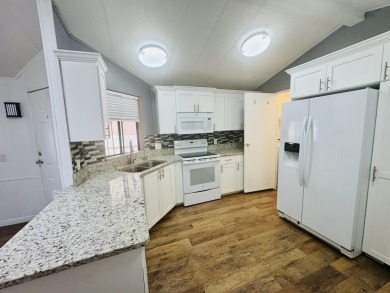 This immaculate 2-bedroom, 2-bath manufactured home is a rare on The Ledges Golf Club in Utah - for sale on GolfHomes.com, golf home, golf lot