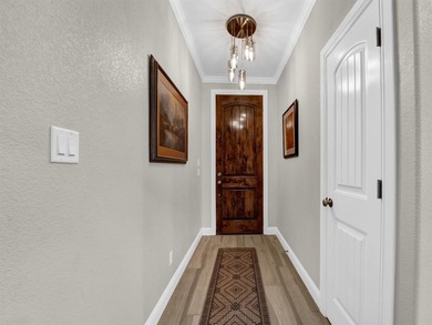 Exceptional home in Pecan Plantation featuring a private hangar on Pecan Plantation Country Club in Texas - for sale on GolfHomes.com, golf home, golf lot