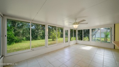 Welcome to this charming ranch-style home in the desirable Palm on Palm Harbor Golf Club in Florida - for sale on GolfHomes.com, golf home, golf lot