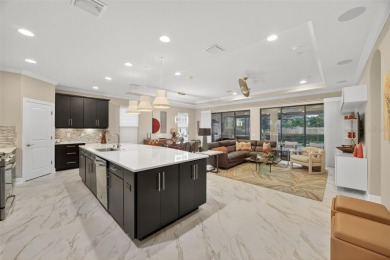 Impeccably Upgraded Piceno Model | 2BR + Den | Outdoor Oasis on Esplanade Golf and Country at Lakewood Ranch in Florida - for sale on GolfHomes.com, golf home, golf lot