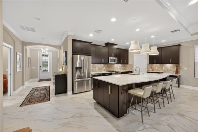 Impeccably Upgraded Piceno Model | 2BR + Den | Outdoor Oasis on Esplanade Golf and Country at Lakewood Ranch in Florida - for sale on GolfHomes.com, golf home, golf lot