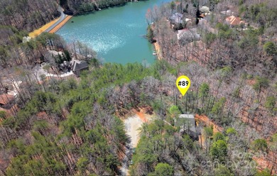 Discover a rare opportunity to craft your luxury lake retreat in on Rumbling Bald Resort on Lake Lure in North Carolina - for sale on GolfHomes.com, golf home, golf lot