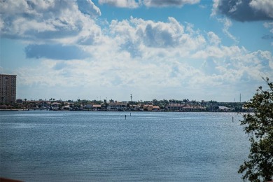 Located in the walkable and charming island community of Isla on Isla Del Sol Yacht and Country Club in Florida - for sale on GolfHomes.com, golf home, golf lot