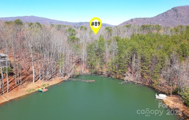 Discover a rare opportunity to craft your luxury lake retreat in on Rumbling Bald Resort on Lake Lure in North Carolina - for sale on GolfHomes.com, golf home, golf lot