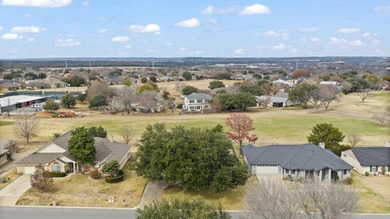This newly listed home in coveted Meadowlakes offers handsome on Hidden Falls Golf Club in Texas - for sale on GolfHomes.com, golf home, golf lot