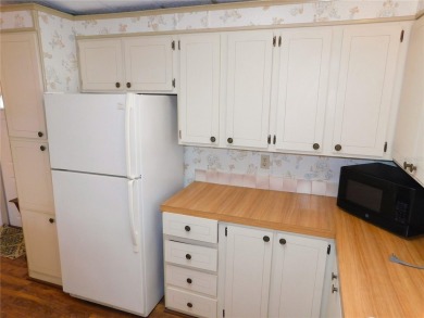 This charming, fully furnished home is perfect for both relaxing on Betmar Acres Golf Club in Florida - for sale on GolfHomes.com, golf home, golf lot