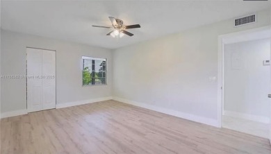 Buyer fell through--this beautifully updated corner unit is on Flamingo Lakes Country Club in Florida - for sale on GolfHomes.com, golf home, golf lot