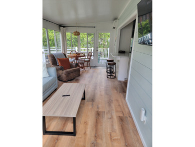 This two bedroom, 1.5 half bath Park Model is located in highly on Point Sebago Golf/Beach Resort in Maine - for sale on GolfHomes.com, golf home, golf lot