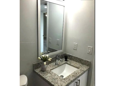 Buyer fell through--this beautifully updated corner unit is on Flamingo Lakes Country Club in Florida - for sale on GolfHomes.com, golf home, golf lot