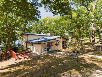 Welcome to 32280 Gliding Hawk, where modern luxury meets serene on Indian Rock Golf Club in Missouri - for sale on GolfHomes.com, golf home, golf lot